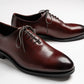 Round toe wholecut oxford in black, Collyer in Brown Red