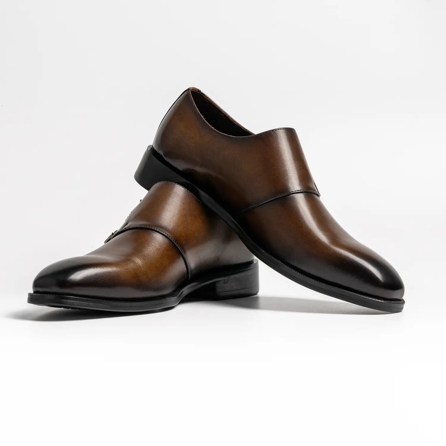 Wholecut double monkstrap in coffee, cross in coffee